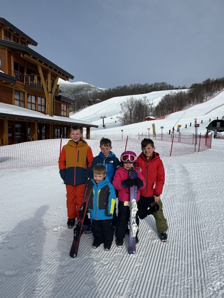image of five kids at base of stowe mountaint resort