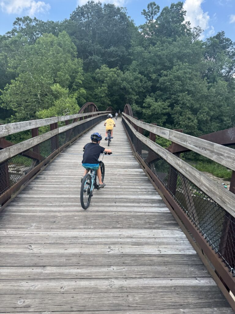 kids biking bridge on GAP trail (allegheny passage)