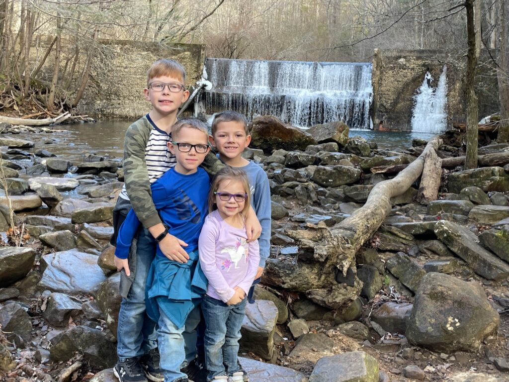 children infront of rainbow falls