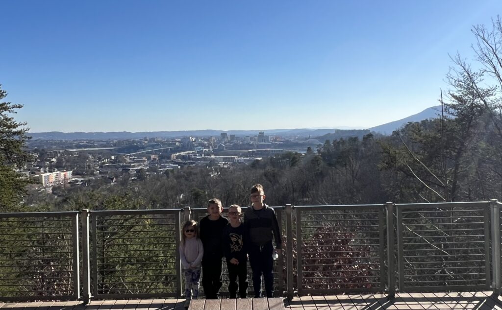Family hiking at Stringers Ridge Park overlooking Chattanooga and Tennessee River.”