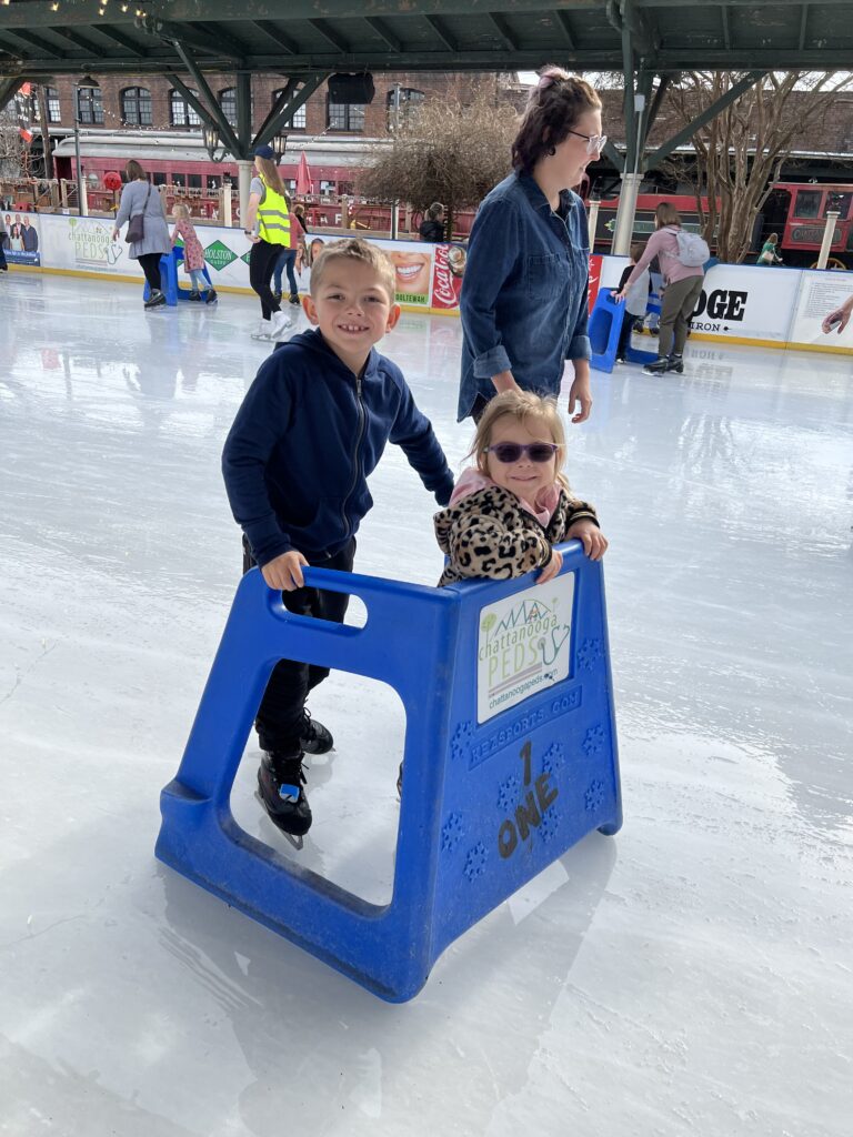 Families ice skating at Ice on the Landing in downtown Chattanooga.