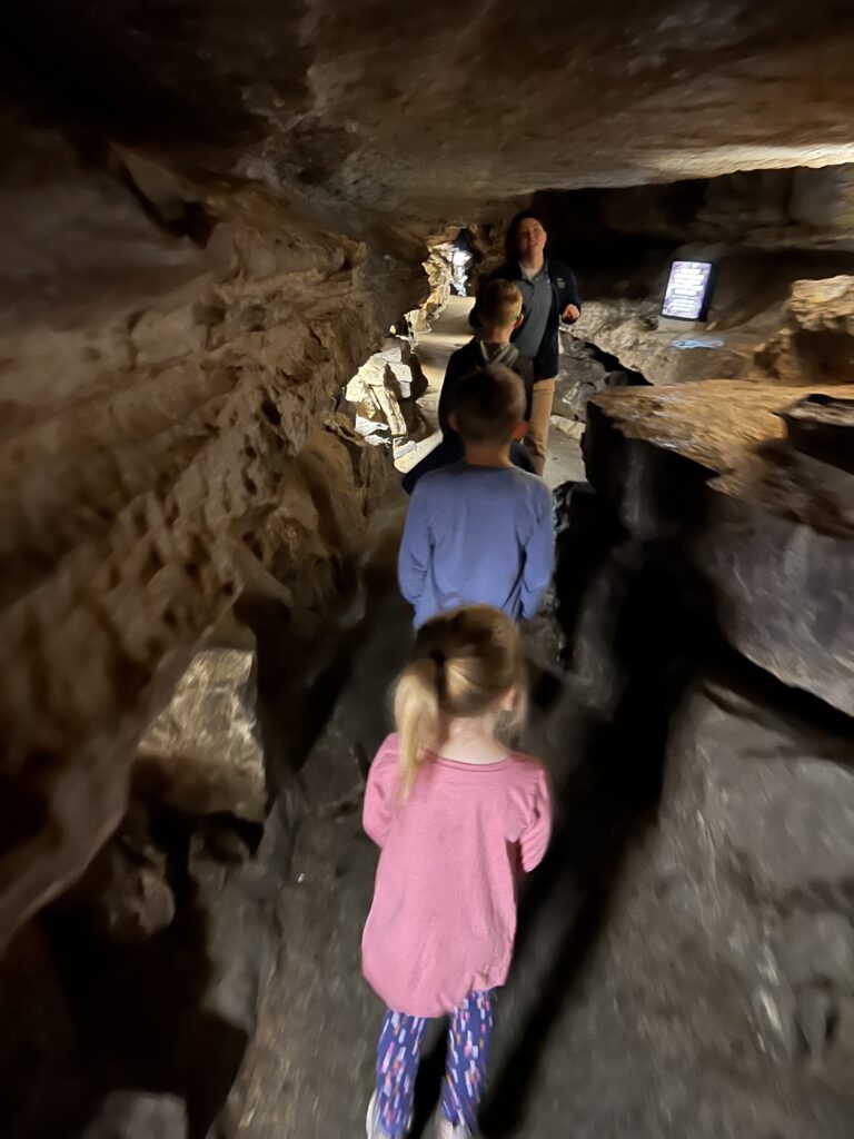 children walking through cave in Ruby Mountain