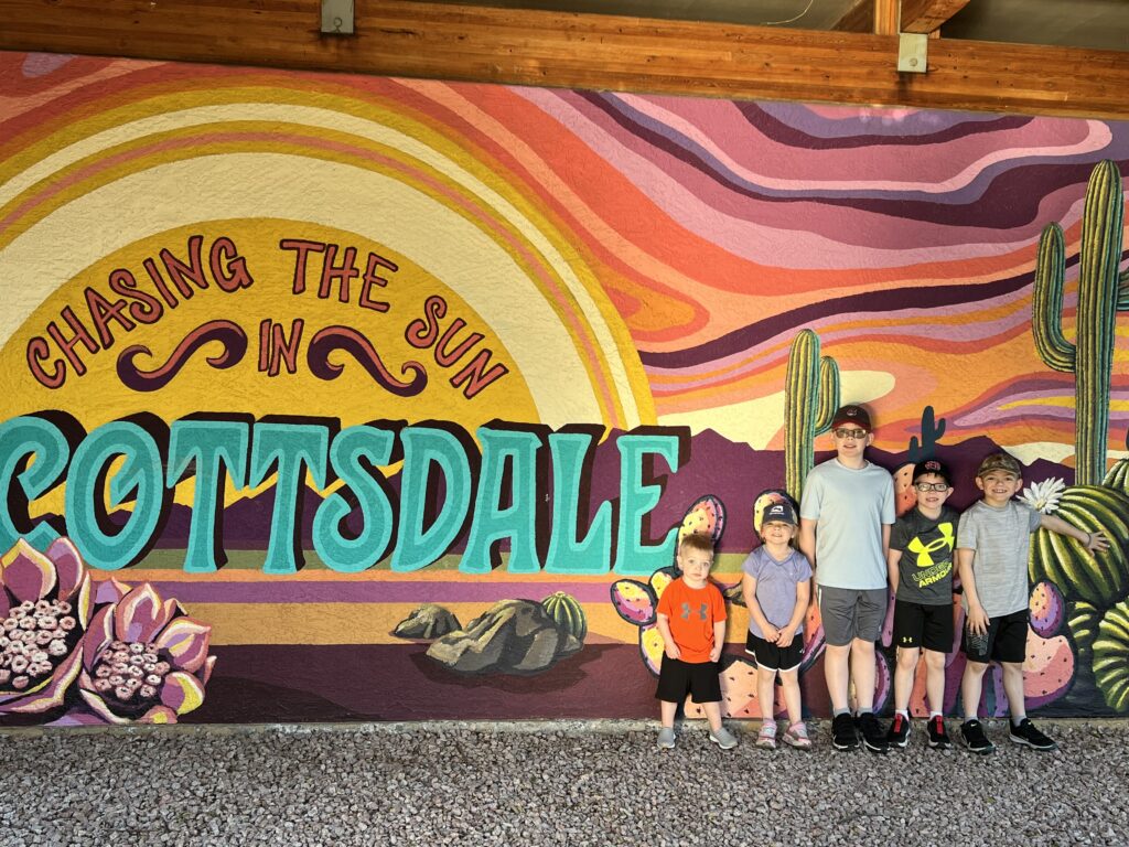kids in front of chasing the sun in scottsdale sign
scottsdale arizona
