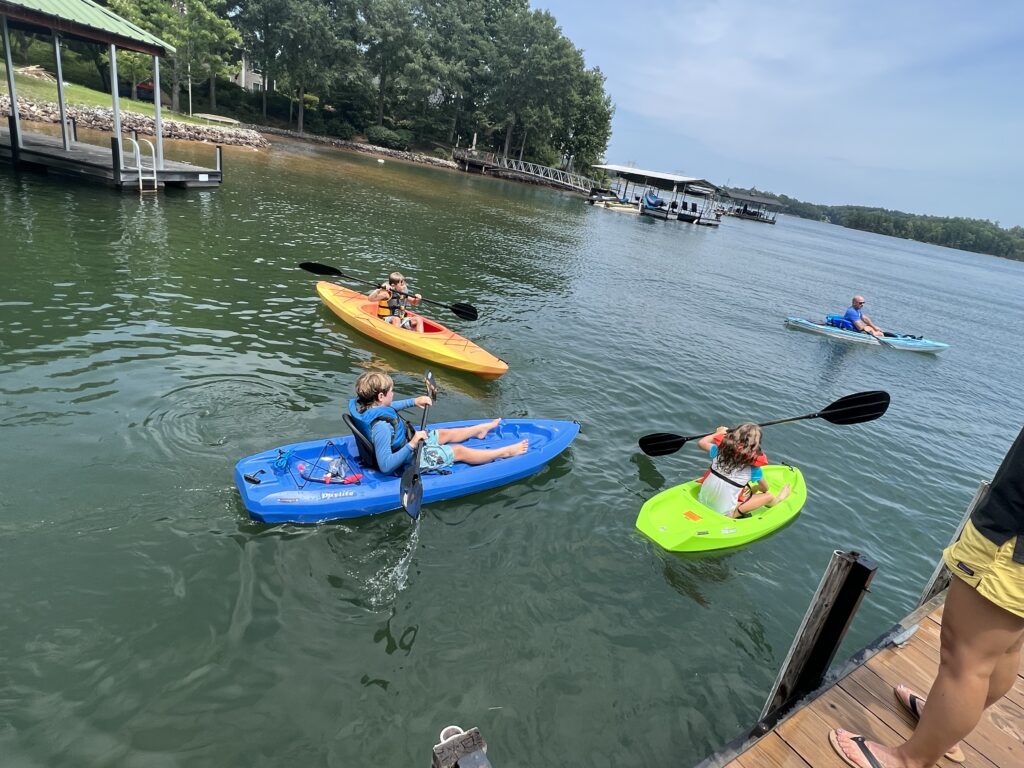 kids kayaking on lake keowee