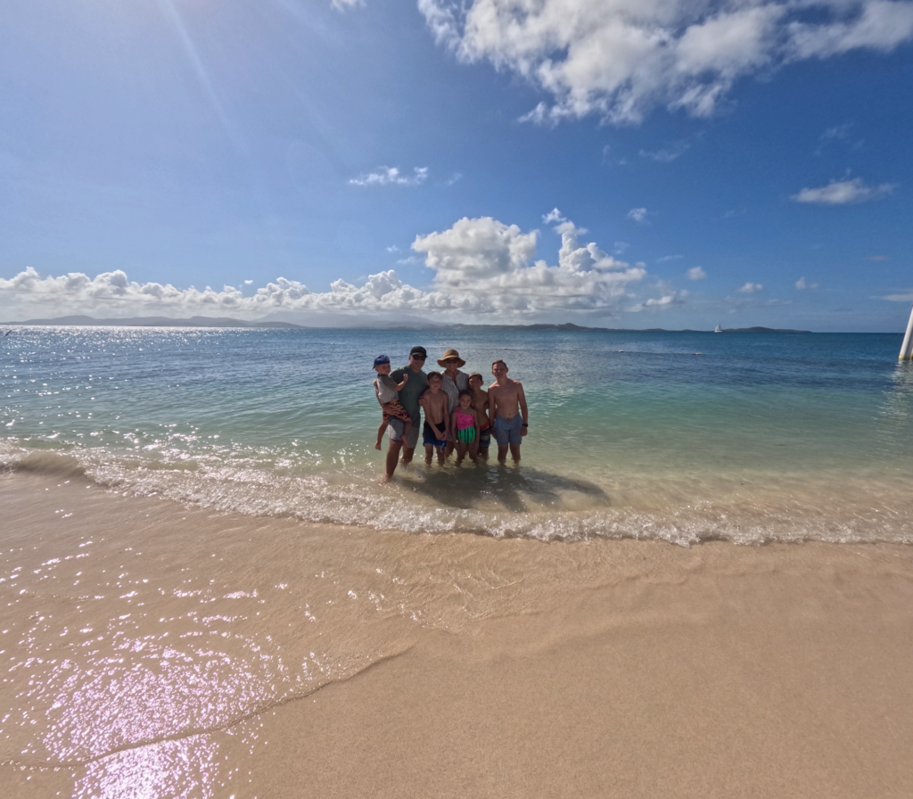 family on beach in palomino island in puerto rico