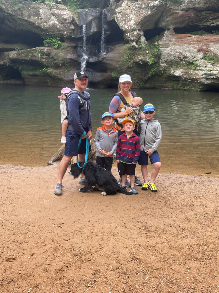 family at water fall in hocking hills family vacation