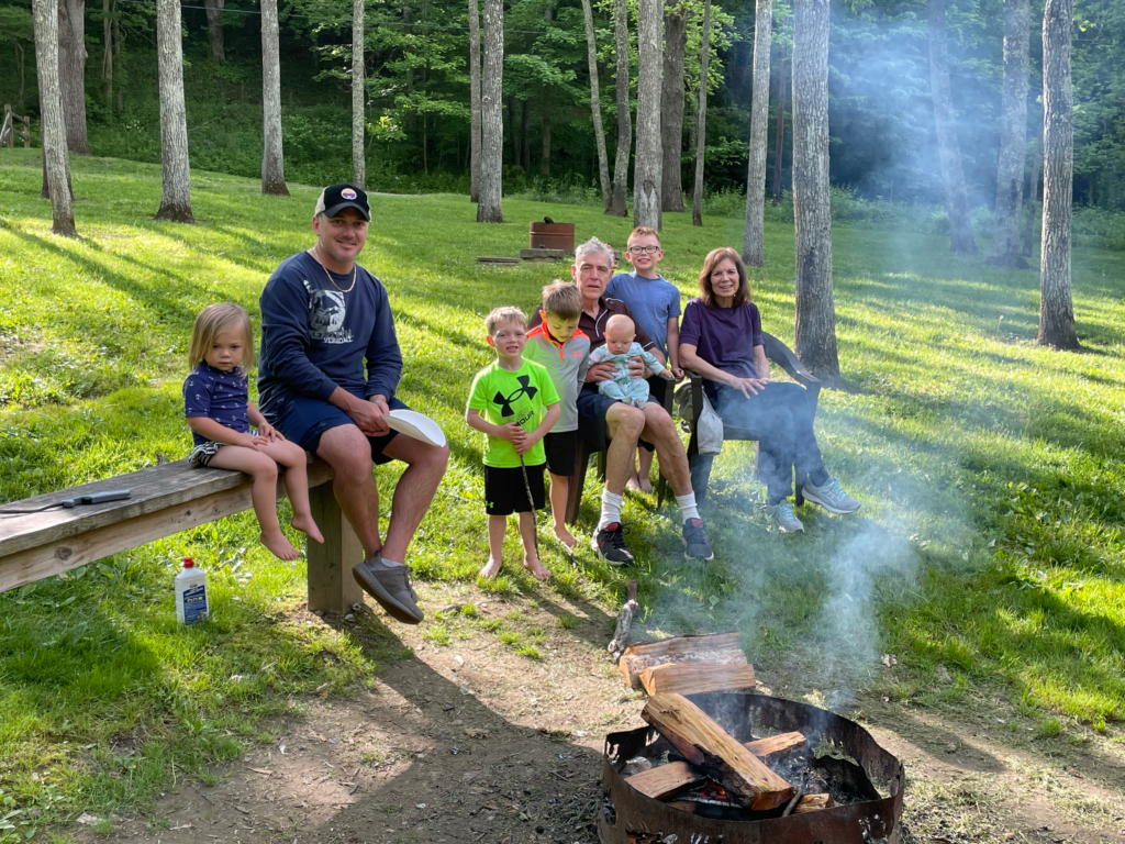 family enjoying fire pit hocking hills ohio
