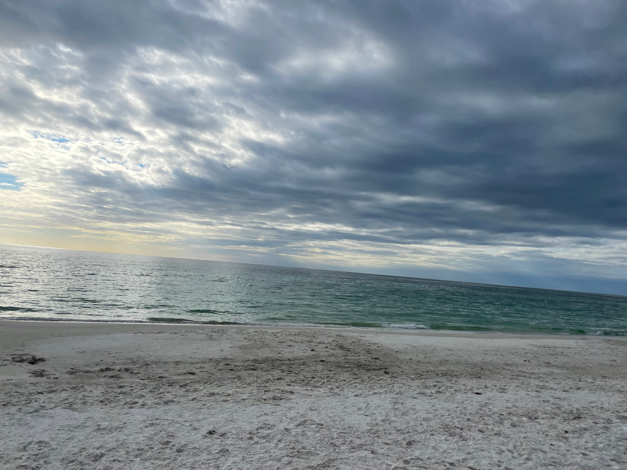 Family beach vacation on Anna Maria Island Florida with white sand and turquoise water