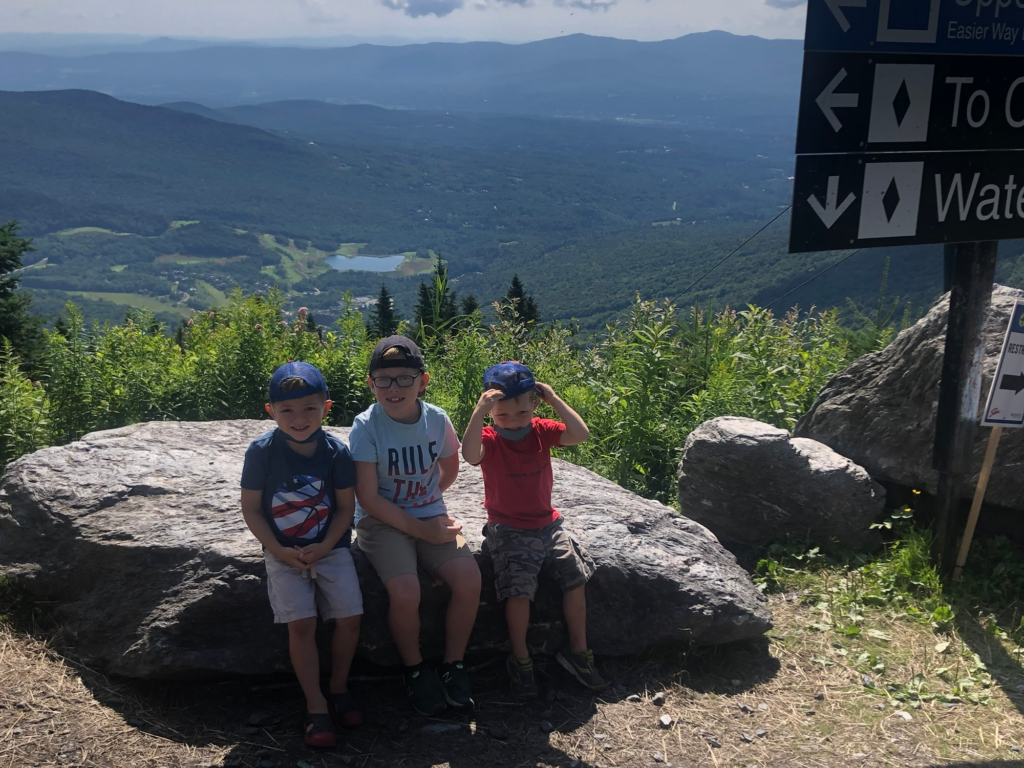 children with mountain view in stowe vt in summer