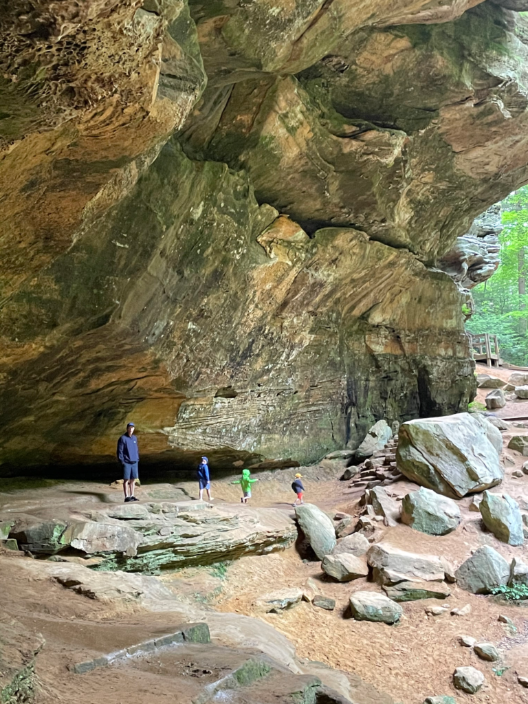 family walking in ash cave hocking hills ohio