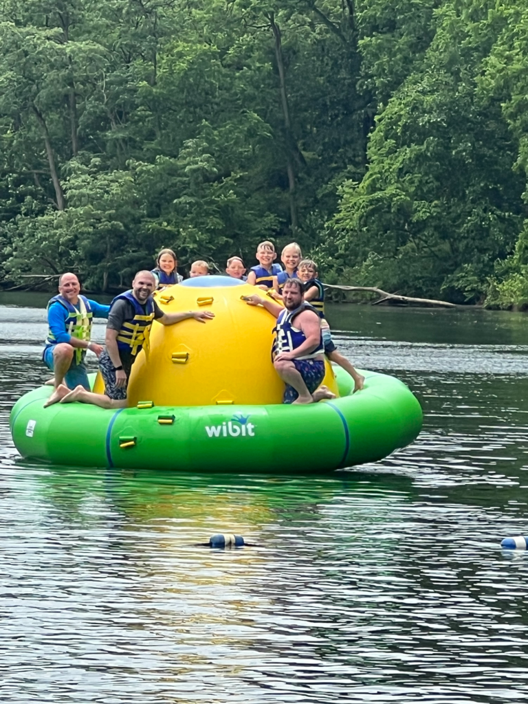a group of people on wibit ninja course austin lake campground steubenville ohio