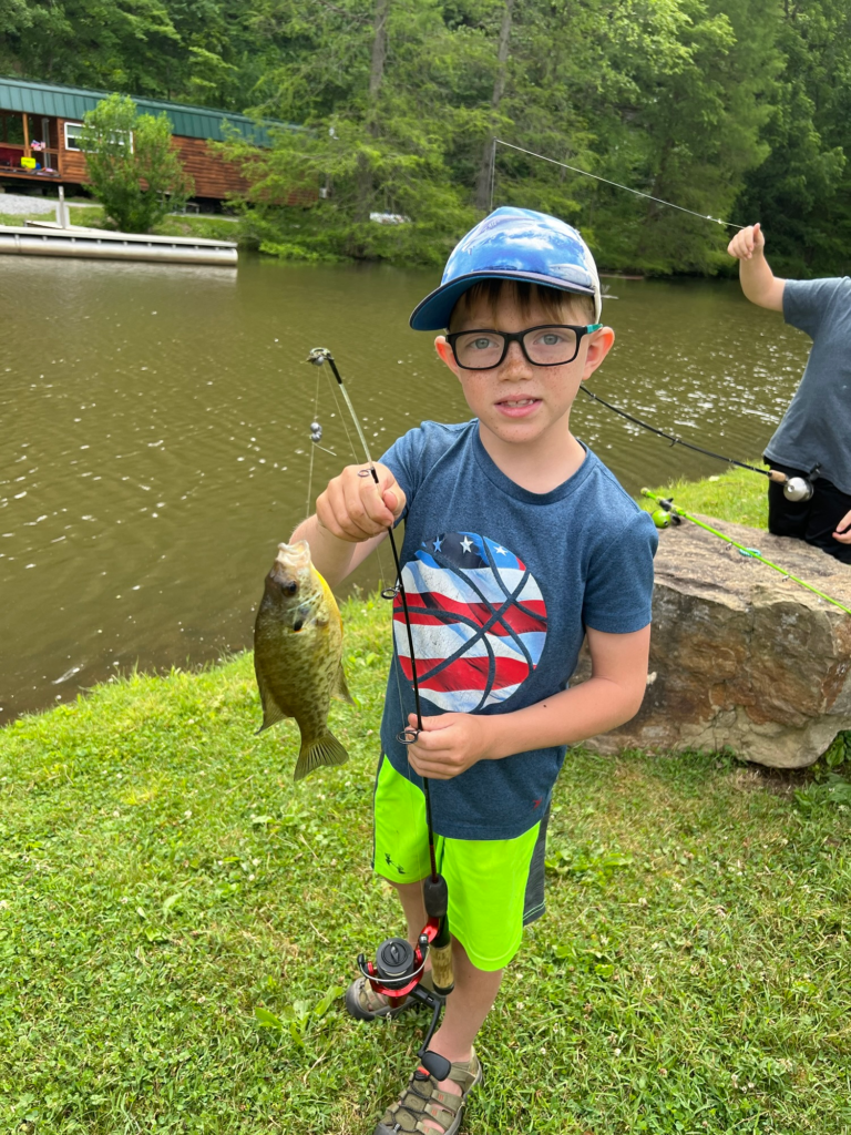 boy with fish at Austin Lake Campground, Steubenville Oh